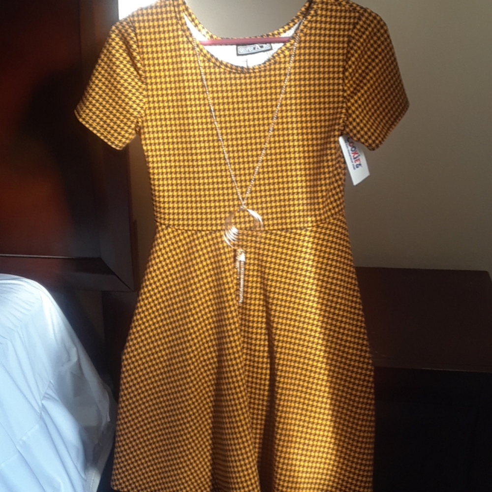 Unique yellow patterned dress with necklace